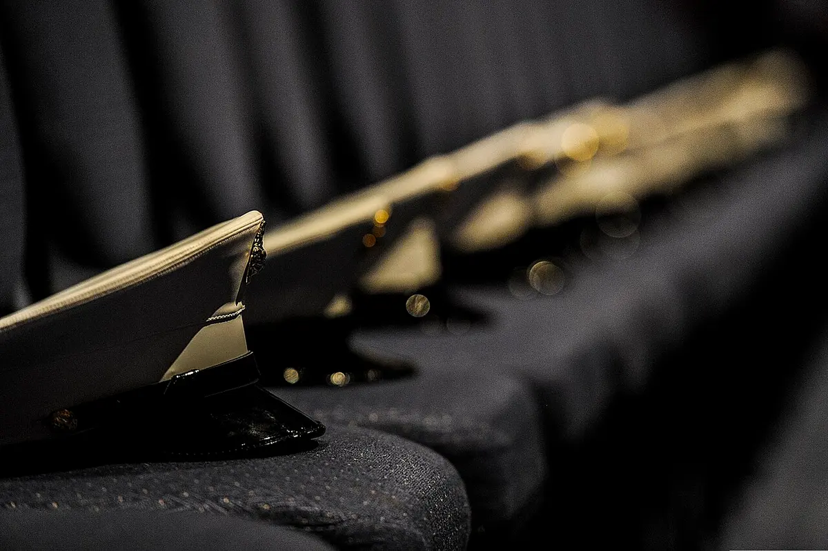 File photo of U.S. Marine Corps hats are displayed during a memorial service Image: Christopher Callaway.