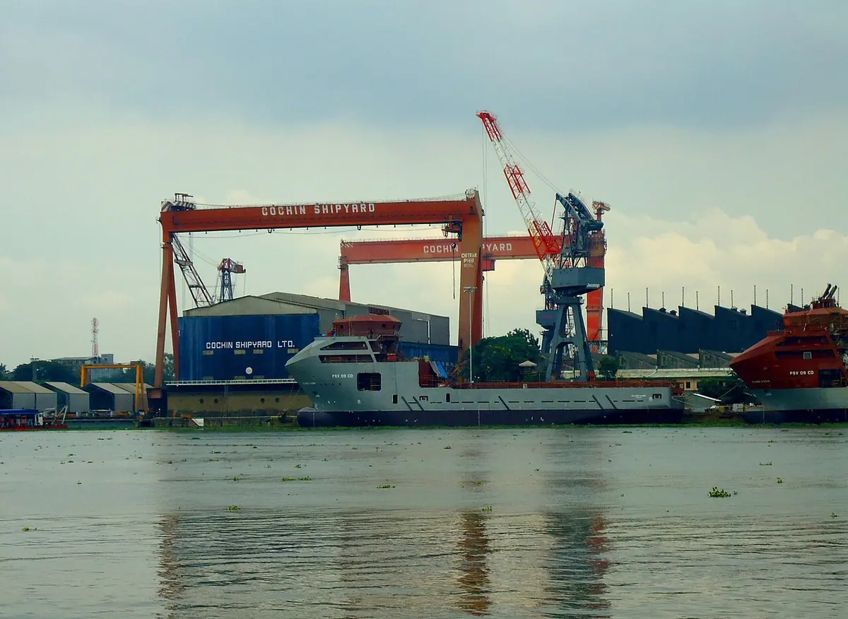 File photo of Kochi shipyards; the oil tanker sits anchored near the city. Image: Ranjithsiji.