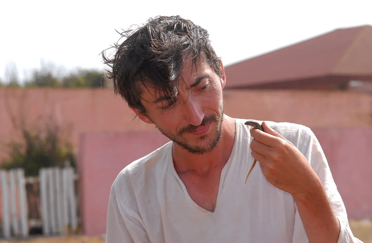 Aurélien Miralles with a Many-scaled Cylindrical Skink in Morocco in July 2012. Image: Mr Philippe Geniez.