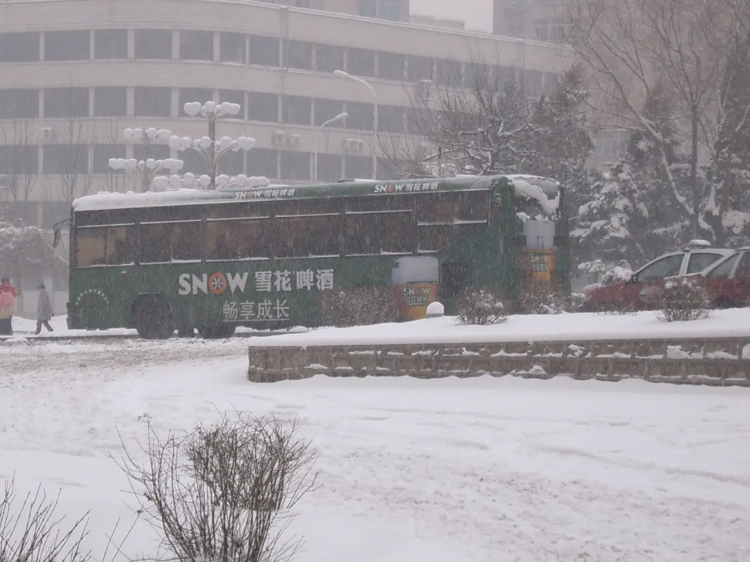 A bus in China during a 2006 winter storm. Image: sarcozona.
