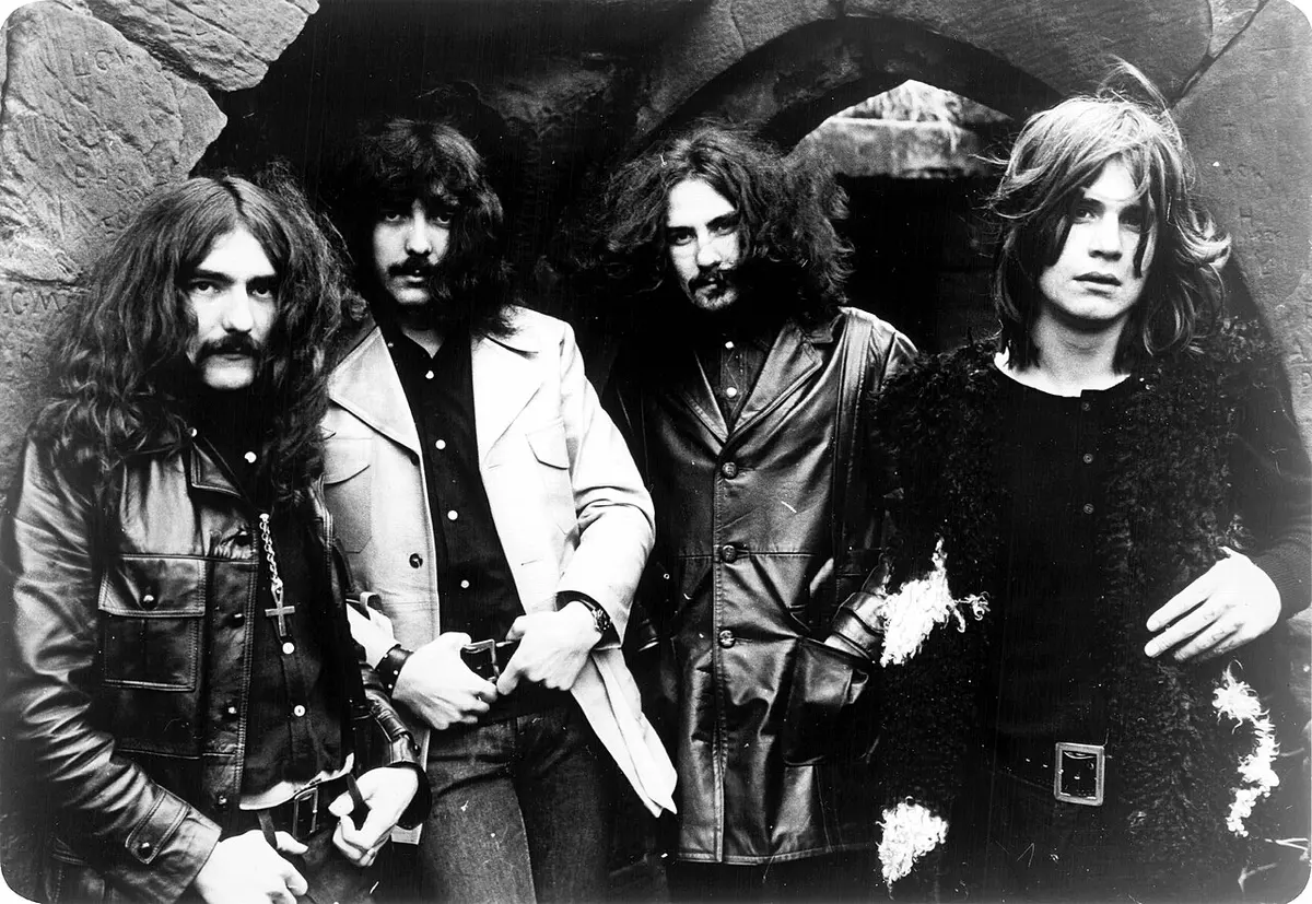 Trade ad for Black Sabbath's album Black Sabbath, 1970. From left to right: Geezer Butler, Tony Iommi, Bill Ward, Ozzy Osbourne. Image: Warner Bros. Records.