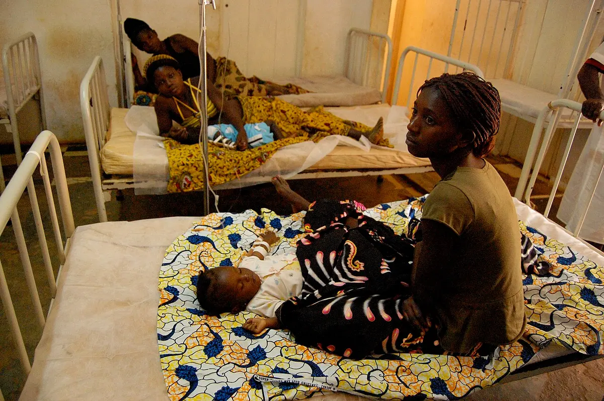 Women tend to their malaria-infected babies in Angola.Image: USAID Africa.