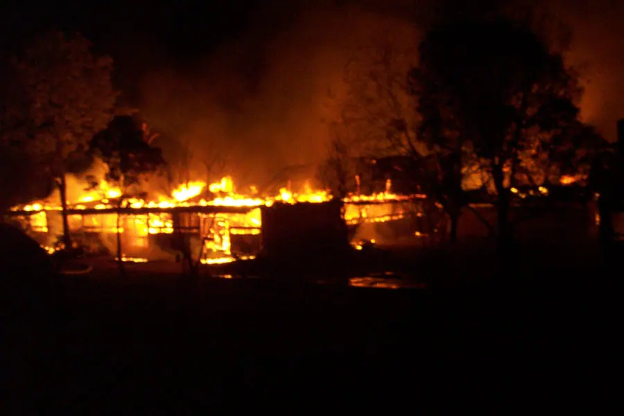 A school burns in 2005. Image: Brian Carter.