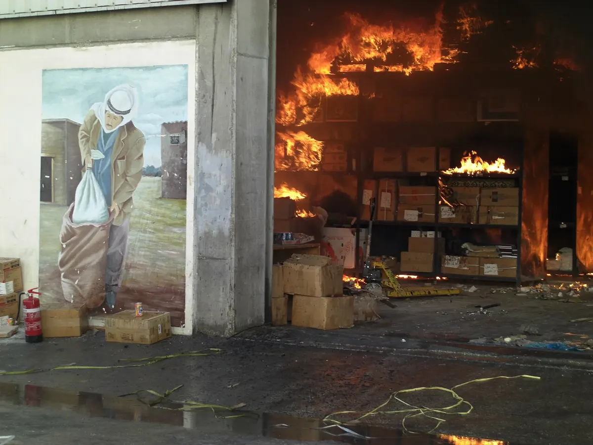 UN aid burns after an UNRWA compound is hit by the Israeli military