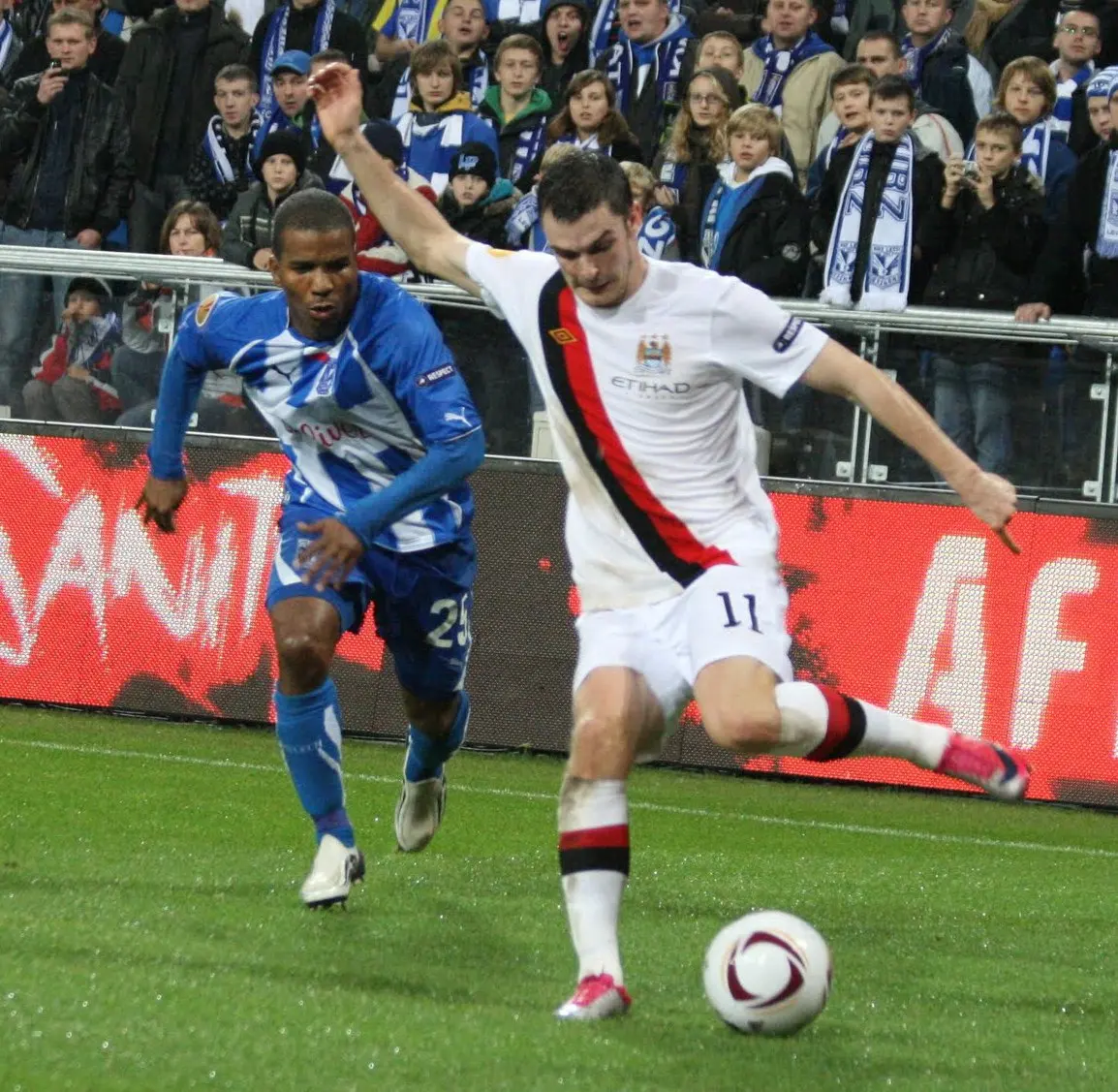 Johnson (right) playing for Manchester City in 2010. Image: Roger Gorączniak.