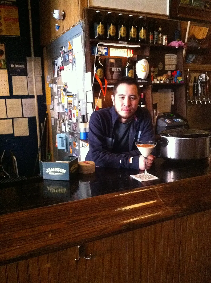 Pacific Standard bar owner Jonathan M. Stan at the bar, preparing the Santorum cocktail drink.