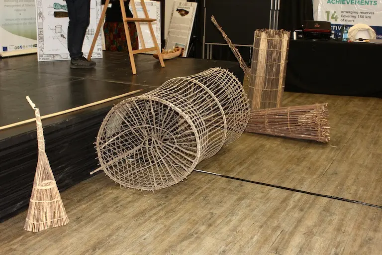 Communities brought some of their traditional fishing gear to showcase at the conference, explaining how the traps work and why they are better than nets. Photo courtesy of Gail Thomson.
