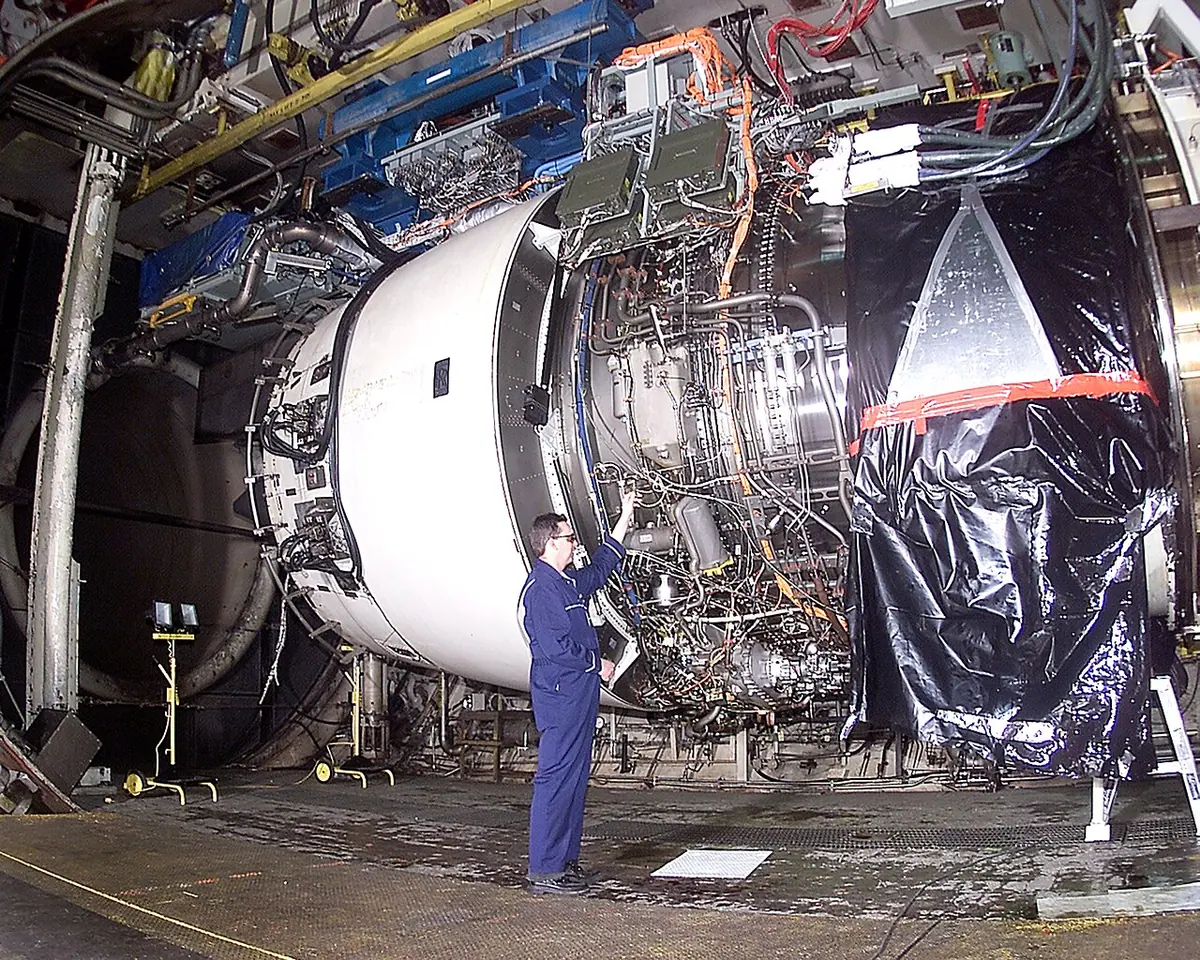 A Rolls-Royce engineer testing a Trent 900 engine. Image: US Air Force.
