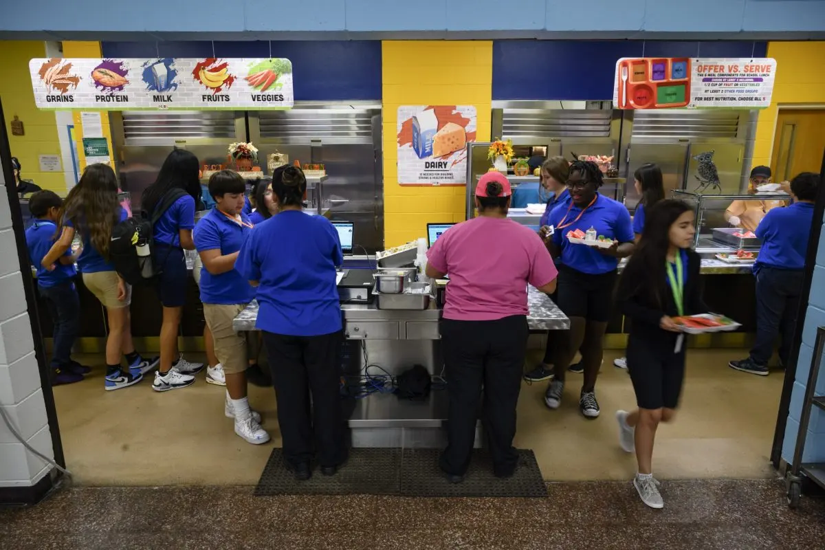 Ector County school district employees serve lunch to Bonham Middle School students on Sept. 13, 2023 in Odessa.