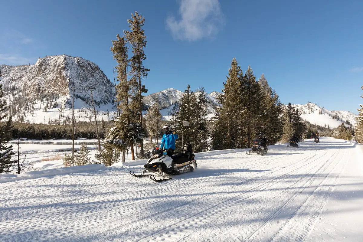 Snowmobile group along the Madison River. NPS / Jacob W. Frank