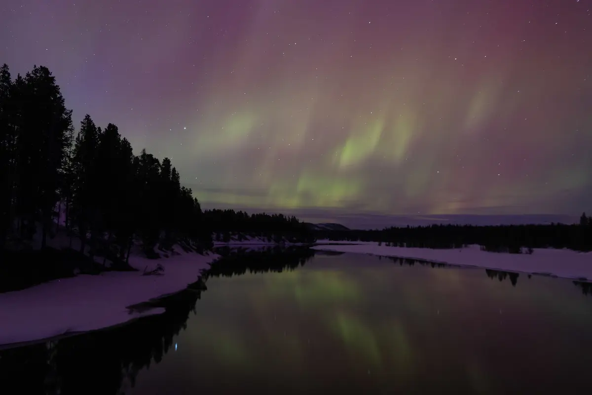 Aurora borealis over the Yellowstone River at Fishing Bridge NPS / A. Falgoust
