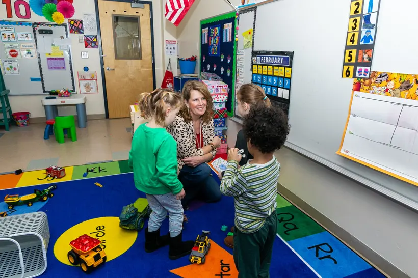 Teacher Assistant Maryann Campagnano works with students at Schalmont Central School District's newly launched universal pre-K program in Schenectady County, February 12, 2026. | Turgay Dakak/New York Focus