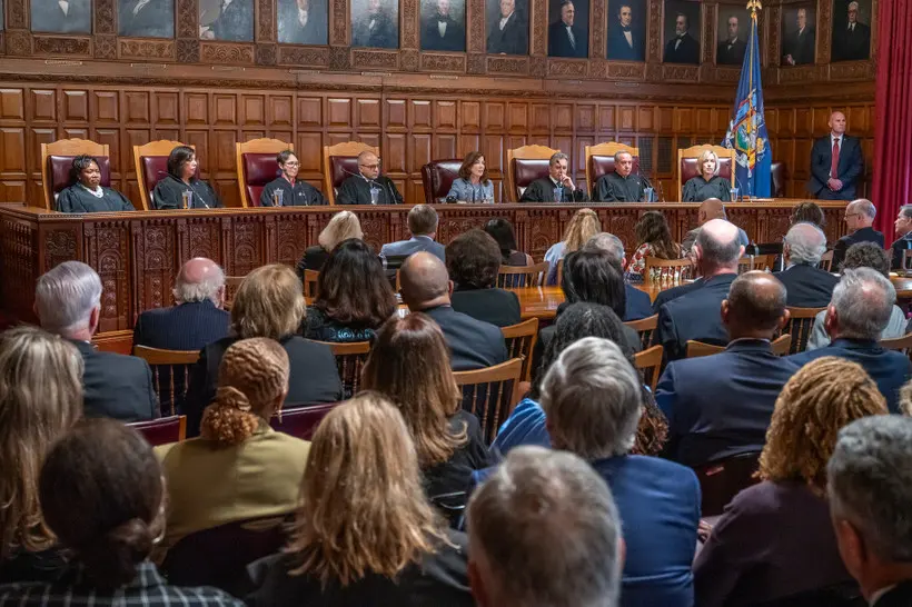 A group of people before the judges of the Court of Appeals