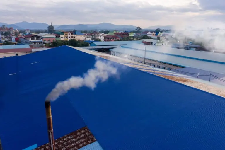 Smoke billows from an incinerator at the Sheng Huang Industries Co., Ltd garment factory in Kampong Speu province, Cambodia. Credit: Andy Ball/Mongabay.