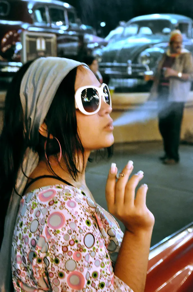 A woman stops to enjoy a cigarette in Venezuela.Image: Carlos Huerta.