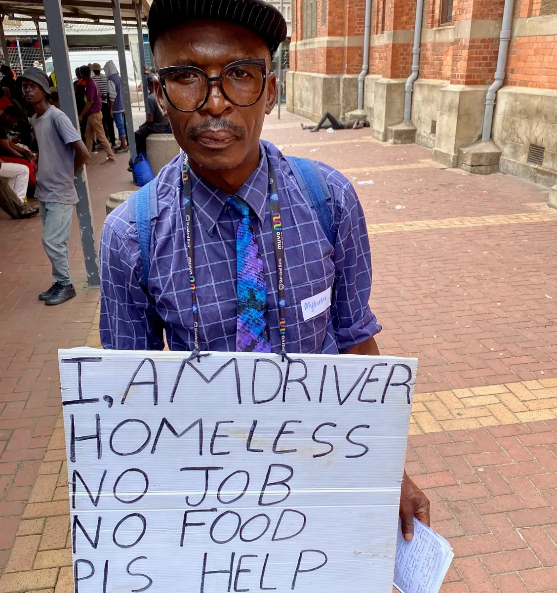 Mykuta Mpana is homeless in Durban. He attended this week’s homeless meeting. “I am a driver. I came here today with this board to see if I could sell myself. I have three children back home in the Eastern Cape that I need to feed.” Photos: Greg Ardé