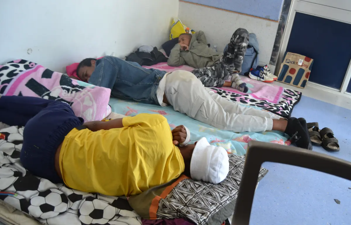 Some of the patients at the Uitenhage Provincial Hospital in Kariega have been lying on the floor in the waiting area because the hospital doesn’t have enough bed space in the wards. Photo: Thamsanqa Mbovane