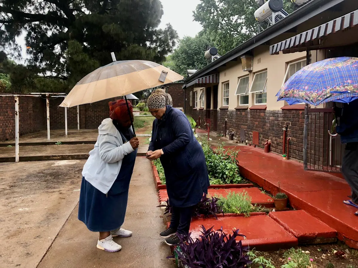 Community leader Yola Minnaar on the right at the Caroline Street complex.