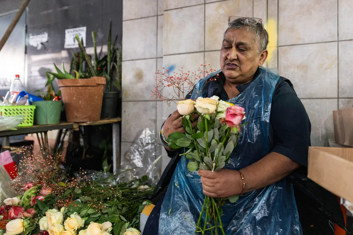 Glenda Bowman prepares a bouquet for a client. She said she wants to make sure the heritage value of the market is protected for future generations.