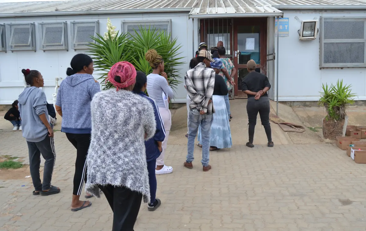 A queue of parents at Alfonso Arries Primary who came to plead that they will pay their R100 donation but only later in the month. Photos: Thamsanqa Mbovane