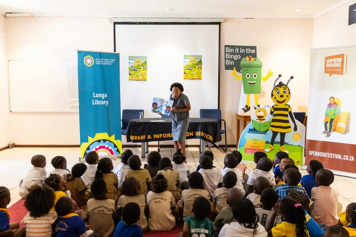 Award-winning author Refiloe Moahloli reads her book ‘A Friend for all Seasons’ to children at the Langa library on Tuesday during the Open Book Festival, which runs in Cape Town until next week. Photos: Ashraf Hendricks
